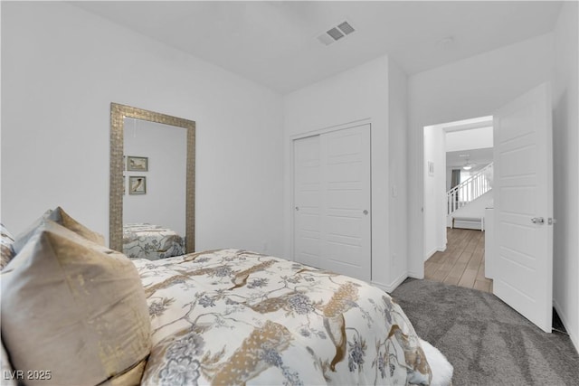 carpeted bedroom featuring a closet