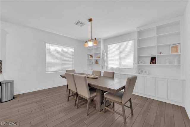 dining room with wood finished floors and baseboards