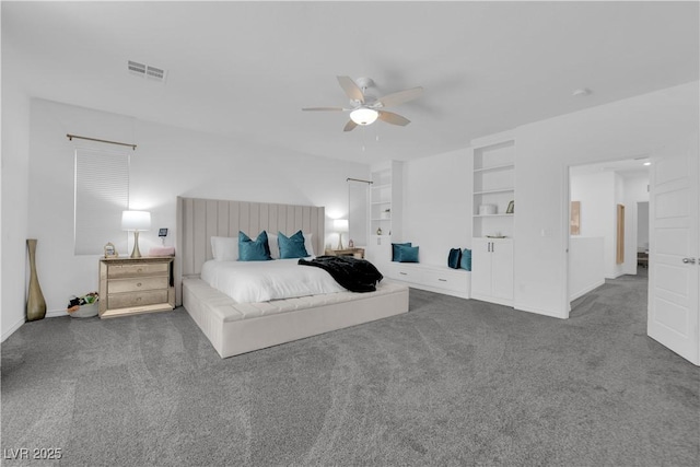 carpeted bedroom featuring baseboards and a ceiling fan