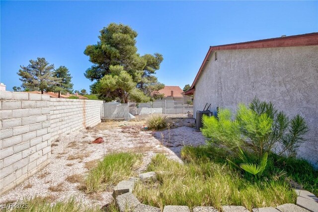 2700 Osborne Ln, Henderson, NV 89014 - fenced backyard with central AC unit