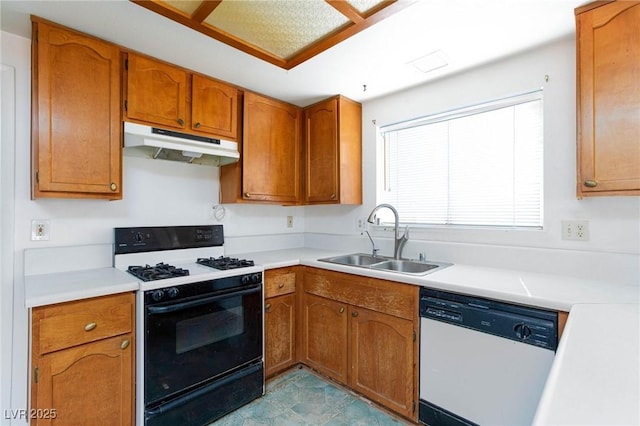 2700 Osborne Ln, Henderson, NV 89014 - kitchen with under cabinet range hood, gas range, dishwasher, a sink, and light countertops
