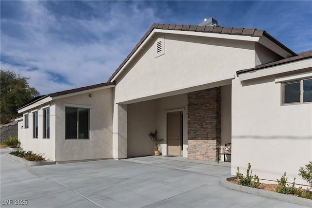 1409 Denver St, Boulder City, NV 89005 - rear view of property with stucco siding and stone siding