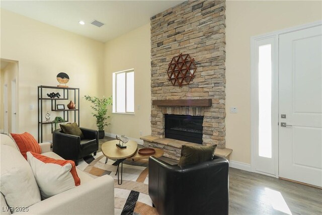 1409 Denver St, Boulder City, NV 89005 - living room with wood finished floors, a fireplace, baseboards, and a towering ceiling