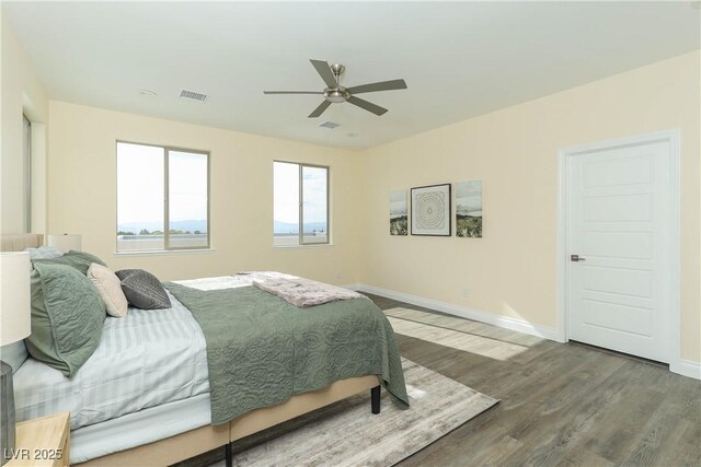 1409 Denver St, Boulder City, NV 89005 - bedroom featuring wood finished floors, baseboards, and a ceiling fan