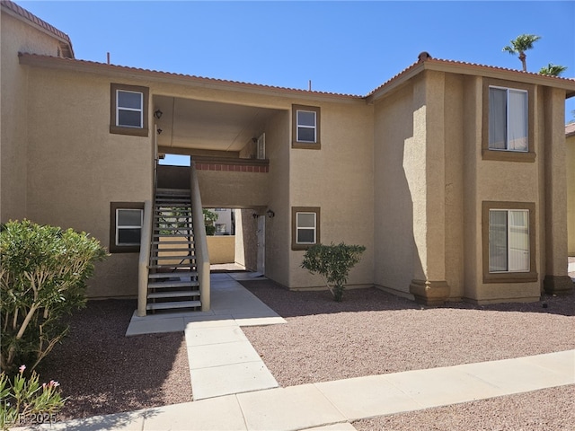 7300 Pirates Cove Rd Unit 2025, Las Vegas, NV 89145 - property entrance with stucco siding and a tile roof