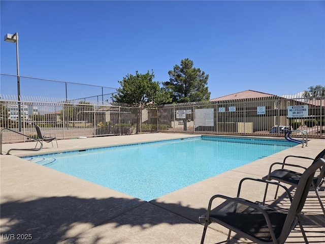 7300 Pirates Cove Rd Unit 2025, Las Vegas, NV 89145 - community pool with fence and a patio area
