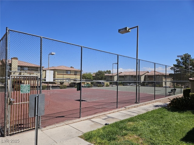 7300 Pirates Cove Rd Unit 2025, Las Vegas, NV 89145 - view of tennis court featuring fence