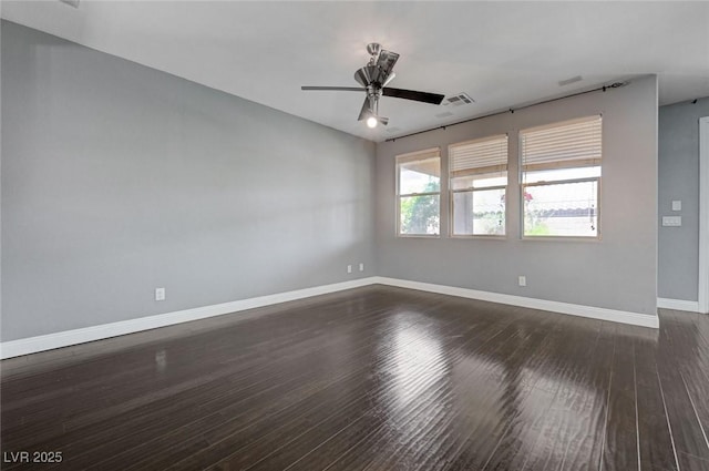 484 Merseyside Dr, Las Vegas, NV 89178 - spare room featuring dark wood-style flooring, baseboards, and a ceiling fan