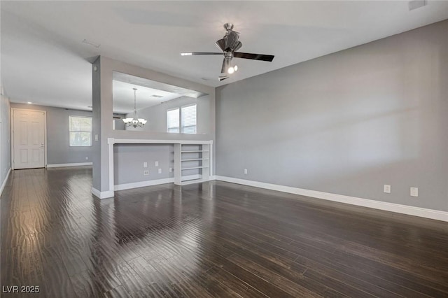 484 Merseyside Dr, Las Vegas, NV 89178 - unfurnished living room with a chandelier, baseboards, dark wood-type flooring, and ceiling fan
