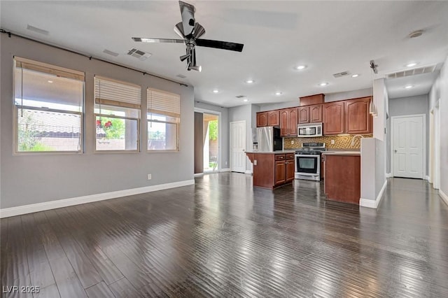 484 Merseyside Dr, Las Vegas, NV 89178 - kitchen featuring appliances with stainless steel finishes, open floor plan, baseboards, and recessed lighting