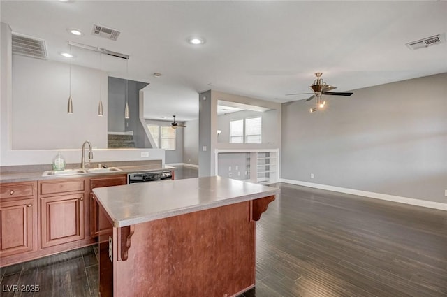 484 Merseyside Dr, Las Vegas, NV 89178 - kitchen with a sink, a ceiling fan, light countertops, a kitchen island, and baseboards