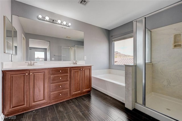 484 Merseyside Dr, Las Vegas, NV 89178 - full bathroom with plenty of natural light, wood finished floors, and a garden tub