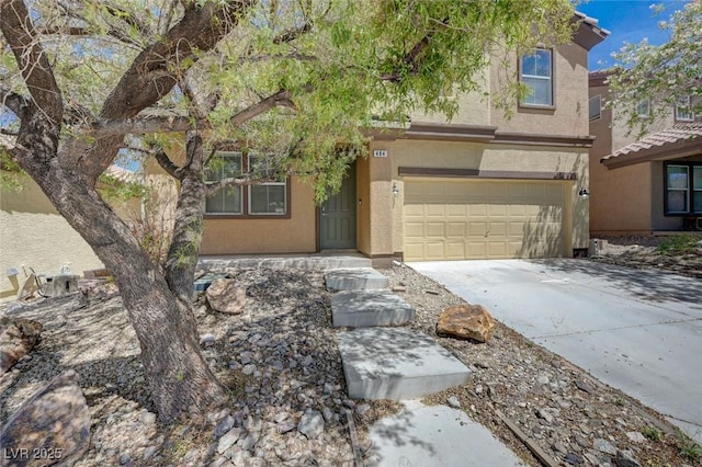 484 Merseyside Dr, Las Vegas, NV 89178 - view of front facade featuring an attached garage, driveway, and stucco siding