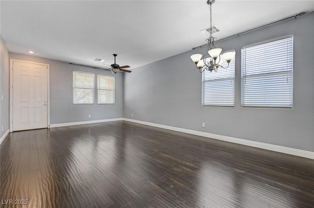 484 Merseyside Dr, Las Vegas, NV 89178 - spare room with a chandelier, baseboards, and dark wood-type flooring