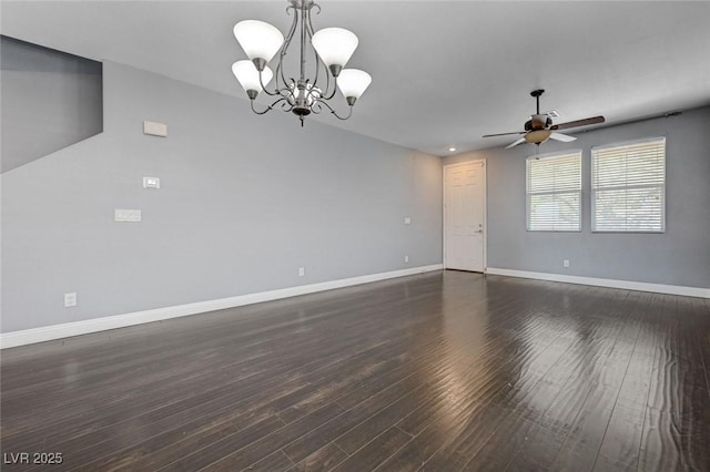 484 Merseyside Dr, Las Vegas, NV 89178 - spare room featuring a ceiling fan, baseboards, a chandelier, and dark wood-type flooring