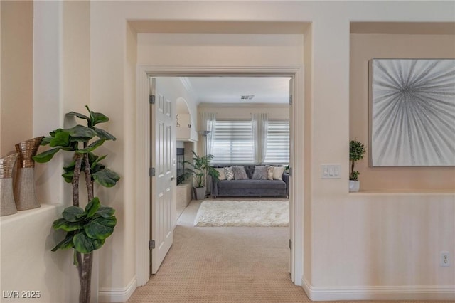 7112 Rancho De Taos Ct, Las Vegas, NV 89130 - hall with carpet floors, crown molding, and baseboards