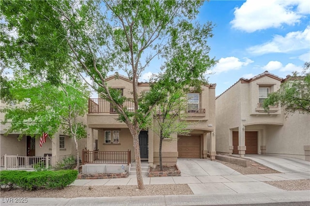 9141 Careful Canvas Ave, Las Vegas, NV 89149 - view of property with a garage, a balcony, driveway, stucco siding, and covered porch