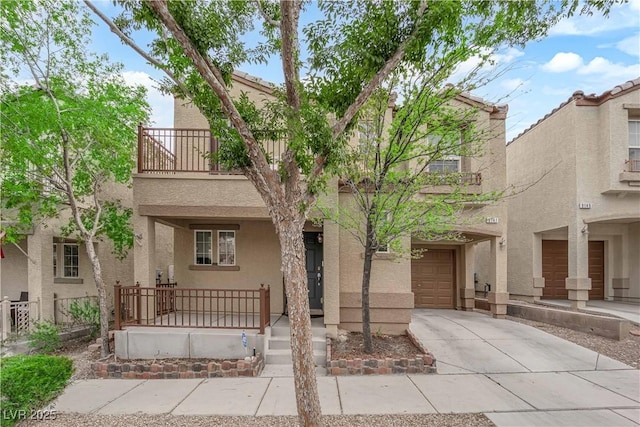 9141 Careful Canvas Ave, Las Vegas, NV 89149 - view of front of property with a porch, stucco siding, concrete driveway, a balcony, and an attached garage