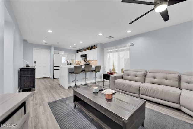 9141 Careful Canvas Ave, Las Vegas, NV 89149 - living room featuring ceiling fan, light wood-style flooring, and recessed lighting