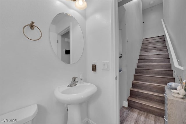 9141 Careful Canvas Ave, Las Vegas, NV 89149 - bathroom with toilet, wood finished floors, and baseboards
