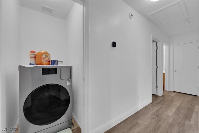 9141 Careful Canvas Ave, Las Vegas, NV 89149 - laundry room with washer / clothes dryer, wood finished floors, baseboards, and attic access