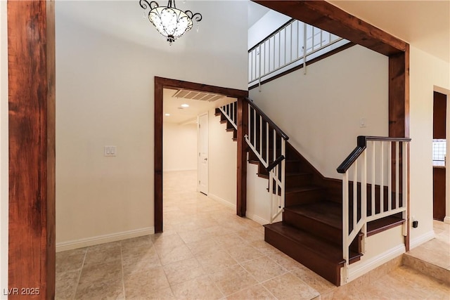 1440 Rawhide Rd, Boulder City, NV 89005 - stairs with baseboards, a chandelier, and tile patterned flooring