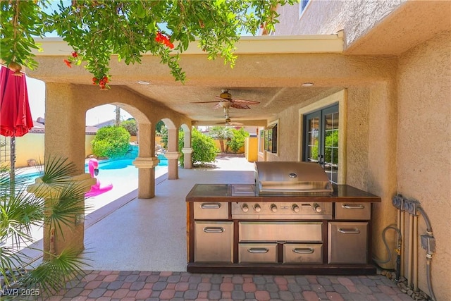 1440 Rawhide Rd, Boulder City, NV 89005 - view of patio with exterior kitchen, a ceiling fan, and grilling area