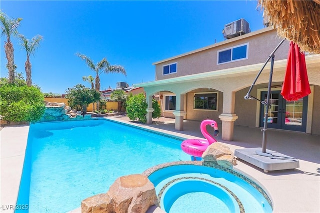 1440 Rawhide Rd, Boulder City, NV 89005 - view of swimming pool with a patio, a pool with connected hot tub, and central AC