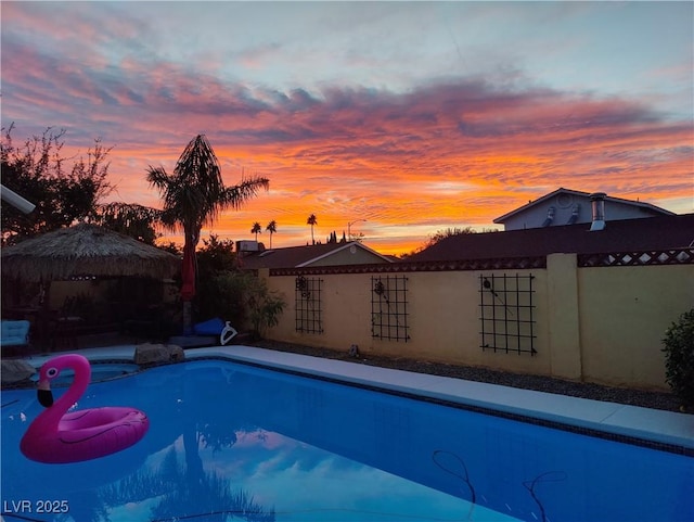 1440 Rawhide Rd, Boulder City, NV 89005 - pool at dusk featuring fence