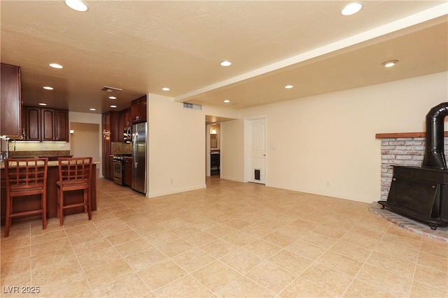 1440 Rawhide Rd, Boulder City, NV 89005 - living room featuring a wood stove and recessed lighting