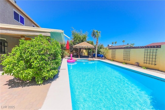 1440 Rawhide Rd, Boulder City, NV 89005 - view of swimming pool with a gazebo, ceiling fan, a pool with connected hot tub, and fence