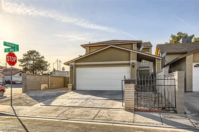 27 Sirnoble St, Las Vegas, NV 89110 - view of front of house with stucco siding, driveway, an attached garage, and fence