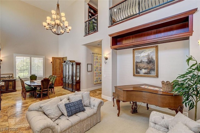 1182 Thomas Bay Cir, Logandale, NV 89021 - living area featuring a chandelier, a towering ceiling, and baseboards