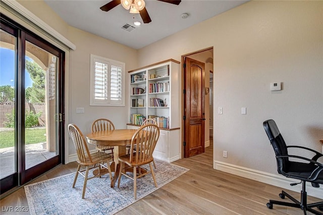 1182 Thomas Bay Cir, Logandale, NV 89021 - dining space with ceiling fan, light wood-style flooring, baseboards, and an office area