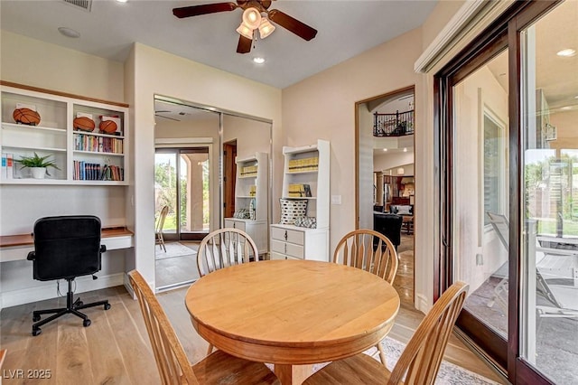 1182 Thomas Bay Cir, Logandale, NV 89021 - dining room with light wood finished floors, ceiling fan, and recessed lighting