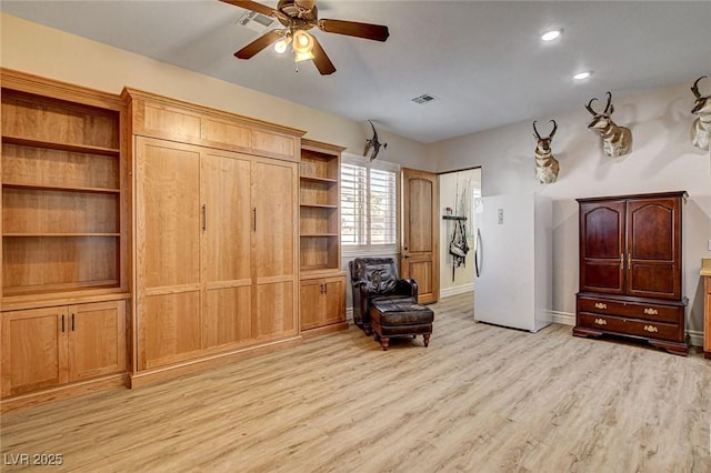 1182 Thomas Bay Cir, Logandale, NV 89021 - sitting room with light wood-style floors, ceiling fan, baseboards, and recessed lighting