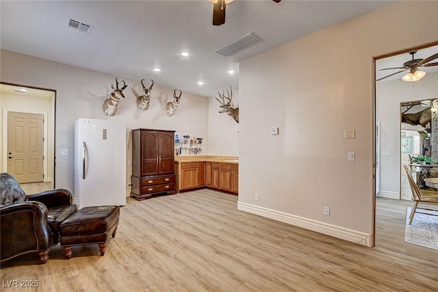 1182 Thomas Bay Cir, Logandale, NV 89021 - living room featuring a ceiling fan, light wood finished floors, baseboards, and recessed lighting