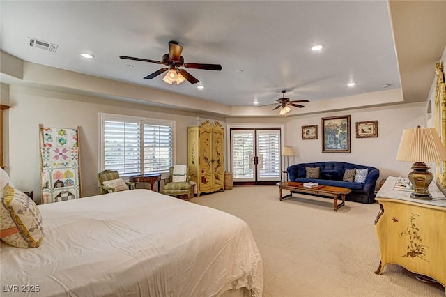 1182 Thomas Bay Cir, Logandale, NV 89021 - carpeted bedroom featuring a tray ceiling, multiple windows, recessed lighting, and ceiling fan