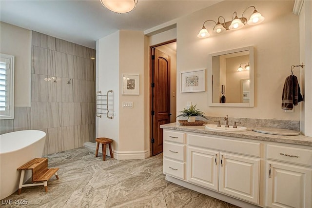 1182 Thomas Bay Cir, Logandale, NV 89021 - bathroom with vanity, a walk in shower, marble finish floors, tile walls, and a soaking tub