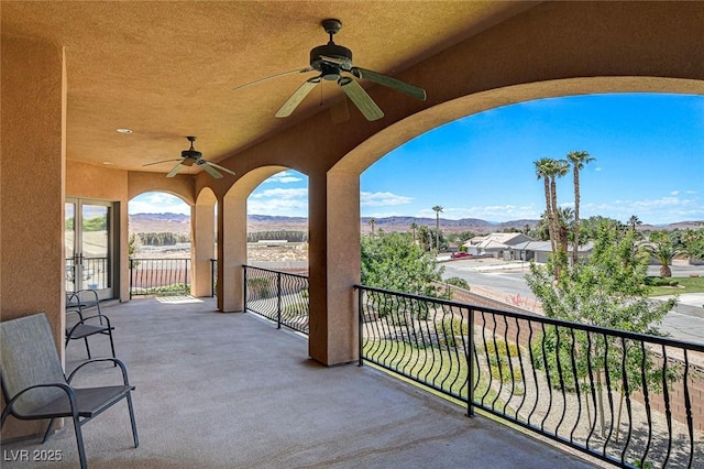 1182 Thomas Bay Cir, Logandale, NV 89021 - view of patio / terrace with ceiling fan, a mountain view, and a balcony