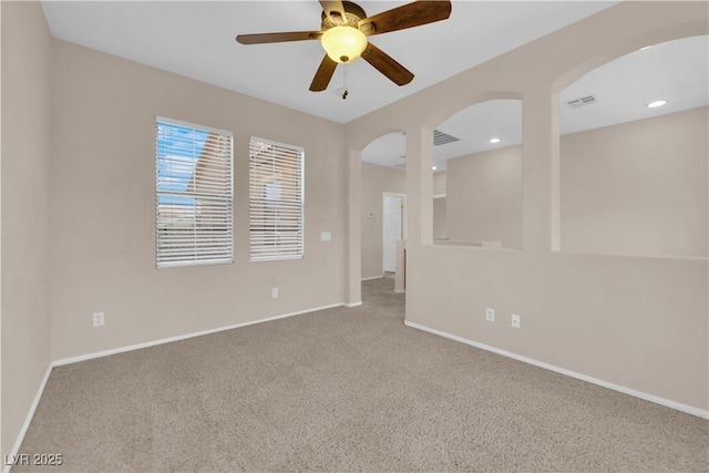11237 Newbury Hills Ave, Las Vegas, NV 89138 - spare room featuring carpet flooring, arched walkways, and ceiling fan