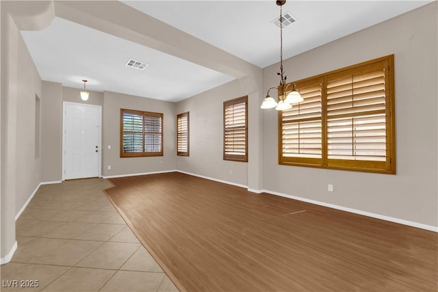 11237 Newbury Hills Ave, Las Vegas, NV 89138 - unfurnished room featuring a chandelier and tile patterned flooring