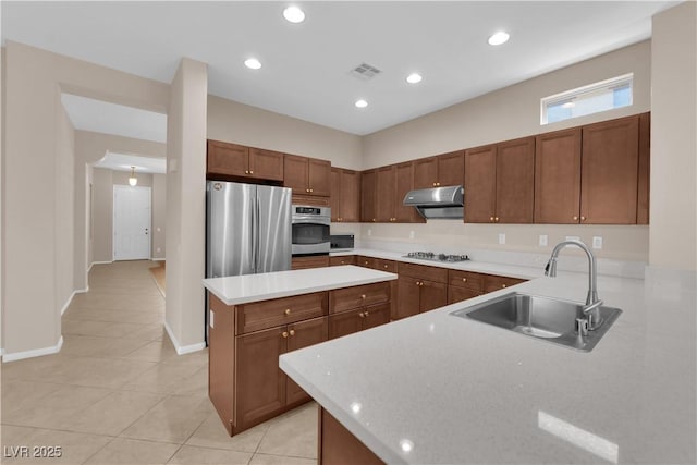 11237 Newbury Hills Ave, Las Vegas, NV 89138 - kitchen with stainless steel appliances, light tile patterned floors, ventilation hood, light countertops, and recessed lighting