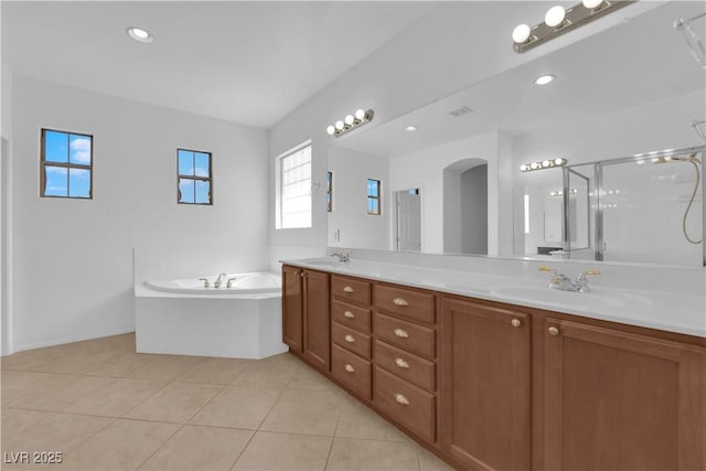 11237 Newbury Hills Ave, Las Vegas, NV 89138 - full bathroom featuring double vanity, a garden tub, tile patterned flooring, a shower with shower door, and recessed lighting