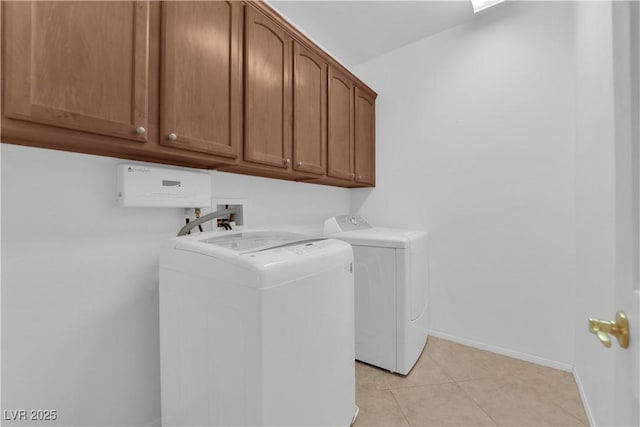 11237 Newbury Hills Ave, Las Vegas, NV 89138 - laundry room featuring cabinet space, washing machine and dryer, and light tile patterned flooring