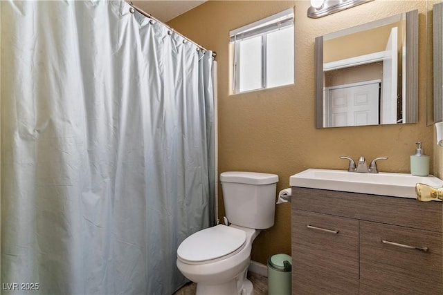7553 Durham Hall Ave Unit 201, Las Vegas, NV 89130 - bathroom featuring toilet, vanity, a textured wall, and a shower with shower curtain