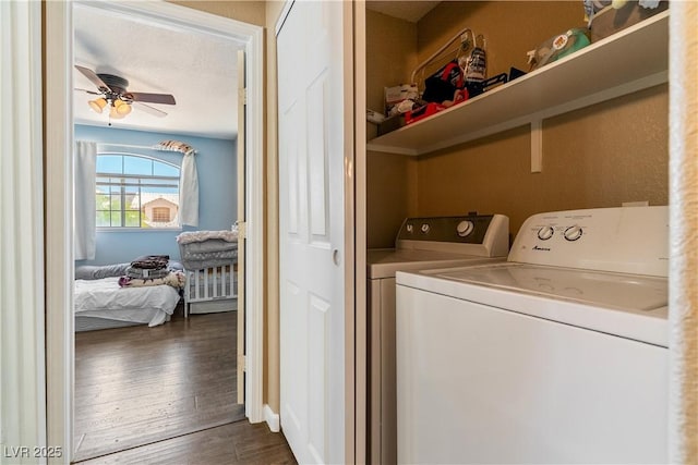 7553 Durham Hall Ave Unit 201, Las Vegas, NV 89130 - washroom with washing machine and clothes dryer, dark wood-style flooring, and ceiling fan