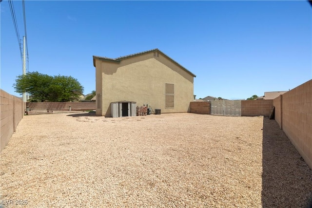 6088 Gulf Island Ave, Las Vegas, NV 89156 - back of property with stucco siding and a fenced backyard