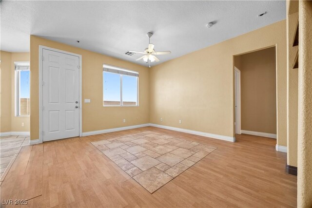 6088 Gulf Island Ave, Las Vegas, NV 89156 - empty room with light wood-type flooring, a ceiling fan, and baseboards