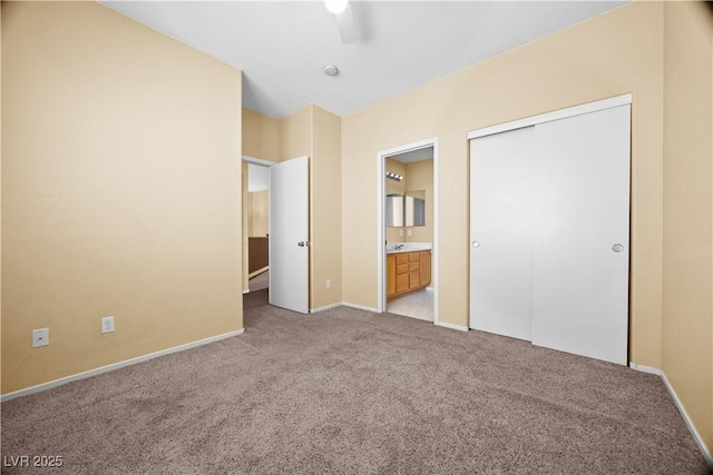 6088 Gulf Island Ave, Las Vegas, NV 89156 - unfurnished bedroom featuring light carpet, baseboards, and ensuite bathroom